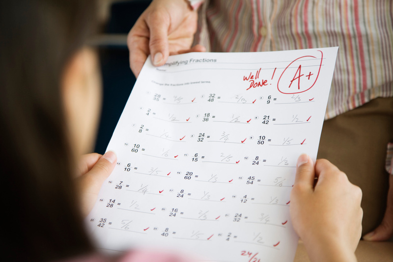 Student Receiving Test with A Grade